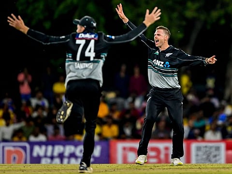 New Zealand's Lockie Ferguson (right) celebrates after taking the wicket of Sri Lanka's captain Charith Asalanka during the second and final Twenty20 international cricket match at the Rangiri Dambulla International Stadium in Dambulla on Sunday.