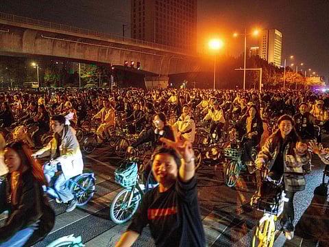 Chinese police have cracked down on an internet craze that saw thousands of cyclists throng a highway under cover of night to gorge on dumplings in a nearby city.