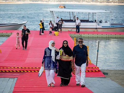 Guests arrive at the temporary dock in the lagoon behind Expo Centre Sharjah, where the book fair is being held till November 17