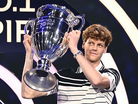 Italy's Jannik Sinner receives the ATP year-end No 1 trophy during the ATP Finals tennis tournament in Turin on Monday.