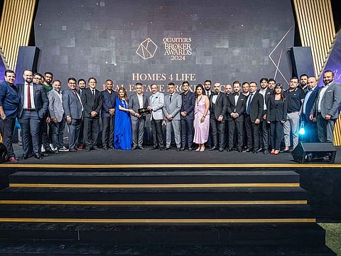 Team Homes 4 Life Real Estate receiving the 8th place award at the EMAAR Q3 2024 Awards.