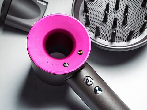 It’s the perfect time to stop balking at price tags, and shortlist a gift for yourself, whether it's a Dyson hair dryer (pictured) or legacy cookware from Le Creuset.