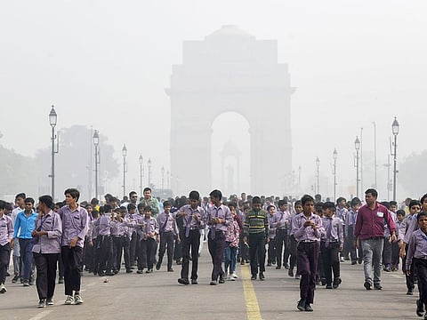 School students visit India amid low visibility due to smog as the air quality falls to ‘severe’ category, at Kartavya Path, in New Delhi on Wednesday.