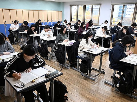 South Korean students wait to take the annual College Scholastic Ability Test, known locally as Suneung, at a school in Seoul on November 14, 2024.