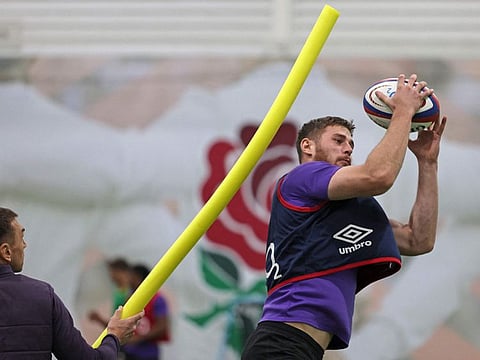 England's defensive coach Kevin Sinfield (left) helps England's full-back Freddie Steward during a training session at Pennyhill Park in Bagshot, south-west of London on November 4.