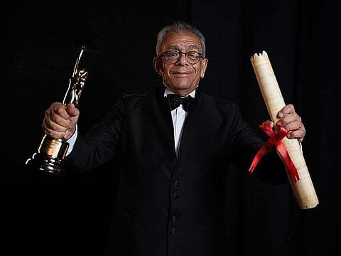 Veteran Egyptian film director Youssry Nasrallah receives a life achievement award at the opening of the Cairo International Film Festival Wednesday night.
