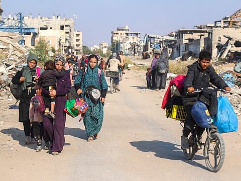 Displaced Palestinians flee Beit Lahia in the northern Gaza Strip, through the main Salah Al Din road on the outskirts of Gaza City, on November 5, 2024.