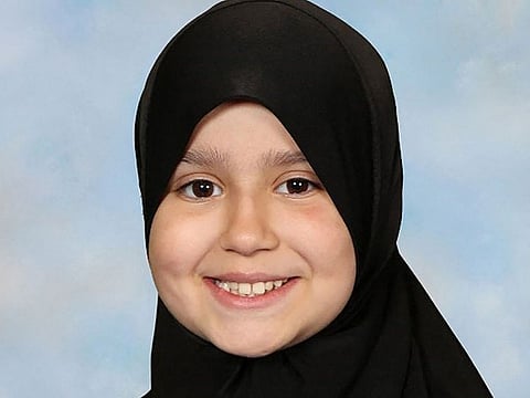 This undated handout photograph released by Surrey Police on October 17, 2024, shows British-Pakistani girl Sara Sharif posing for a portrait wearing a hijab. Beatings, human bites, fractures, iron burns, confinement: nothing had been spared ten-year-old Sara Sharif, killed in the family home in August 2023, and whose father, stepmother and uncle are currently on trial in London.