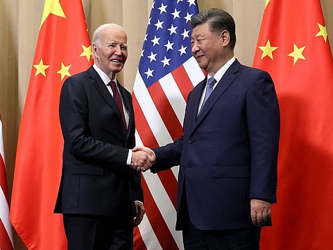 US President Joe Biden (L) shakes hands with Chinese President Xi Jinping on the sidelines of the Asia-Pacific Economic Cooperation (APEC) summit in Lima, Peru.