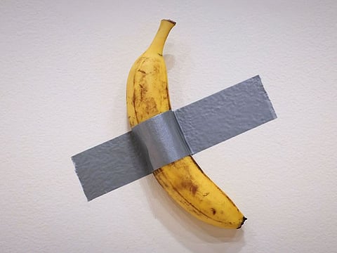 Italian visual artist Maurizio Cattelan's duct-taped Banana entitled "Comedian," is on display during a media preview at Sotheby's in New York, on November 8, 2024.