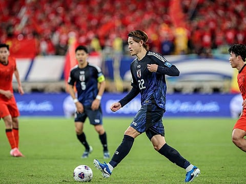 Japan's Ayumu Seko controls the ball during the 2026 Fifa World Cup qualification football match against China in Xiamen, in southeastern China's Fujian province on Tuesday.