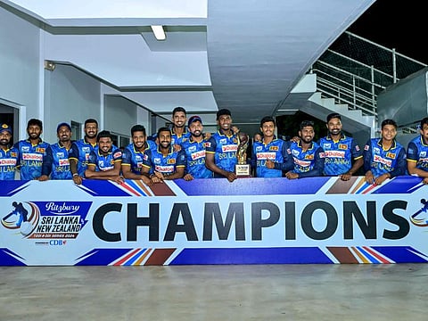 Sri Lanka's players pose with the series trophy after winning the One-Day International cricket series against the New Zealand 2-0, at the Pallekele International Cricket Stadium in Kandy on Tuesday.