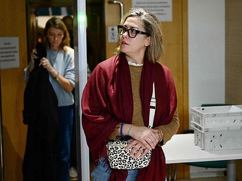 Gisele Pelicot's daughter Caroline Darian leaves the courthouse after a hearing in the trial of her father Dominique Pelicot accused of drugging her mother for nearly ten years and inviting strangers to rape her at their home in Mazan, a small town in the south of France, in Avignon, on November 18, 2024.