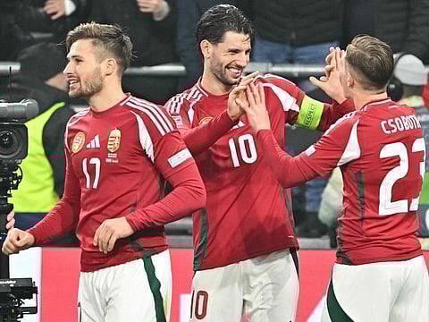 Hungary's midfielder Dominik Szoboszlai (centre) celebrates scoring the goal from the penalty spot with his teammates during the Uefa Nations League Group A3 football match against Hungary at the Puskas Arena in Budapest, Hungary, on Tuesday.
