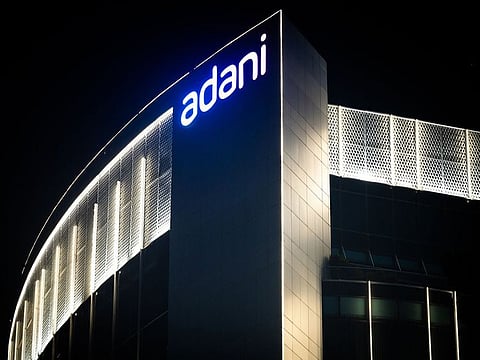 The Adani Group headquarters at night in Ahmedabad, India.