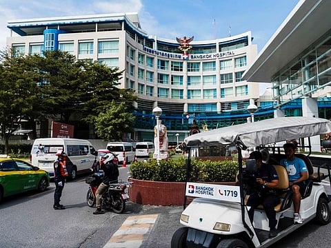 Vehicles line up in front of the Bangkok Hospital in Bangkok on November 21, 2024. A young Australian woman has died and another is fighting for her life in hospital in Bangkok on November 21, 2024 after a suspected mass methanol poisoning in Laos, Australia's prime minister said. (Photo by Chanakarn Laosarakham / AFP)