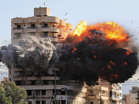 Fire and smoke erupt from a building just after an Israeli airstrike in Beirut's southern Shayah neighbourhood on November 22, 2024.