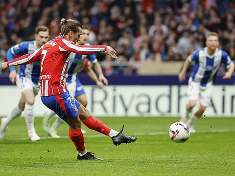 Atletico Madrid's forward Antoine Griezmann scores his team's first goal from the penalty spot during the Spanish league football match against Deportivo Alaves at the Metropolitano stadium in Madrid on November 23, 2024.