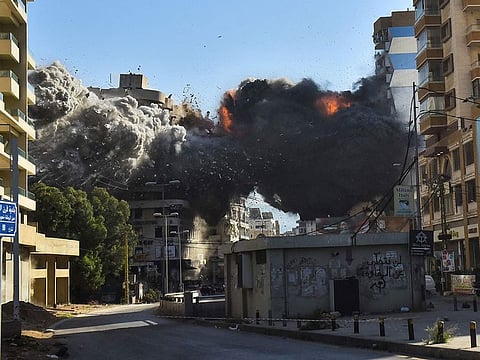 Fire and smoke erupt from a building just after an Israeli airstrike in Beirut's southern Shayah neighbourhood on November 22, 2024, amid the ongoing war between Israel and Hezbollah.