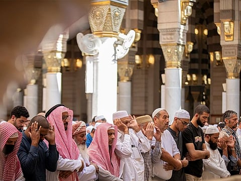 Worshippers perform congregation prayers in the Prophet's Mosque.