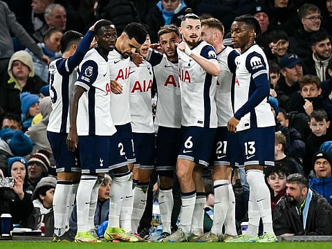 Tottenham Hotspur's midfielder James Maddison (C) celebrates with teammates after scoring his team’s second goal during the English Premier League football match against Manchester City at the Etihad Stadium in Manchester, north west England, on November 23, 2024.