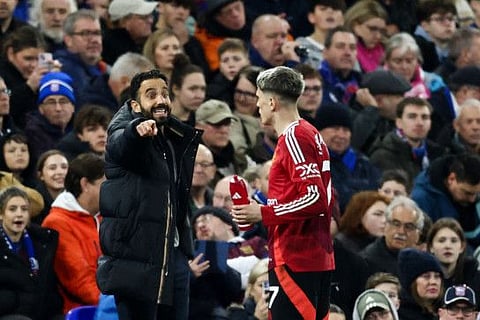 Manchester United's Portuguese head coach Ruben Amorim (left) gives indications to Argentinian midfielder Alejandro Garnacho during the English Premier League football match at Portman Road in Ipswich, eastern England on Sunday.