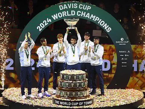 Italy's Matteo Berrettini raises the trophy with teammates after winning the Davis Cup Finals at the Palacio de Deportes Jose Maria Martin Carpena arena in Malaga, southern Spain, on Sunday.