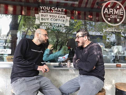 Men sit outdoors in a cafe in the Iranian capital Tehran on November 12, 2024. “Reducing tension with the US is essential for Iran’s economic stability,” said Maciej Wojtal, chief investment officer at Amtelon Capital.