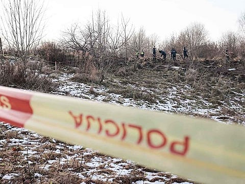 Lithuanian police search the area where a DHL cargo plane crashed near the Vilnius International Airport in Vilnius on November 25, 2024.
