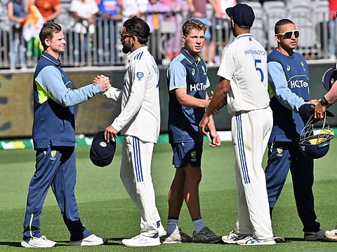 Indias Virat Kohli shakes hands with Australias Steve Smith at the end of the first Test cricket match at Optus Stadium in Perth on Monday.