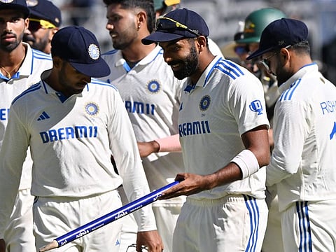 Indias stand-in skipper Jasprit Bumrah (centre) celebrates the victory over Australia with teammates on day four of first Test in Perth on Monday.
