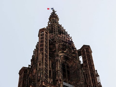The French flag flutters atop the Notre Dame Cathedral of Strasbourg on the occasion of the ceremony commemorating the 80th anniversary of Strasbourg's liberation, in Strasbourg, eastern France, on November 23, 2024.