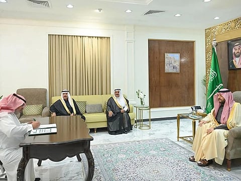 Musab Al Enazi signs a waiver of retribution at the Northern Border governor's office.