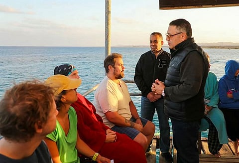 This handout picture released by the Egyptian State Information Service shows Red Sea governor Amr Hanafi speaking to survivors rescued from a capsized vessel in Marsa Alam on November 25, 2024.