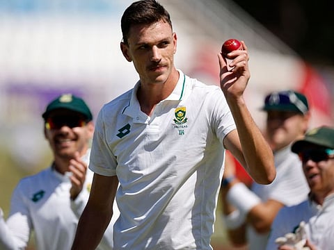 South Africa's Marco Jansen holds the ball as he celebrates taking 7 wickets in the first innings during the second day of the first Test cricket match against and Sri Lanka at the Kingsmead stadium in Durban on Thursday.
