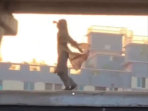 A woman dancing atop a moving train at a Bangladesh railway station had the crowd enthused, but social media users were not amused.