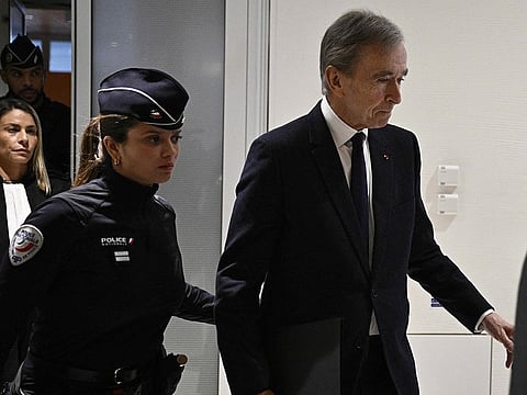 LVMH CEO Bernard Arnault (R) leaves Paris court after testifying in influence-peddling trial against former French intelligence head of internal security Bernard Squarcini, in Paris on November 28, 2024.