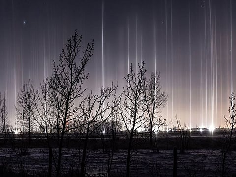 Light pillars seen in Lacombe, Alberta on November 26, 2024.