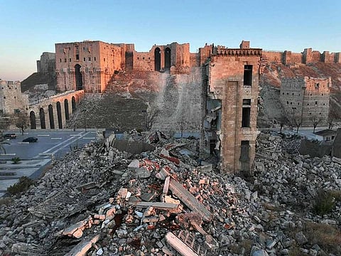 This aerial view shows the landmark citadel of Aleppo and its surroundings damaged by the civil war
