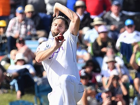England's Chris Woakes bowls during the third day of the first Test cricket match against New Zealand at Hagley Oval in Christchurch on November 30, 2024.