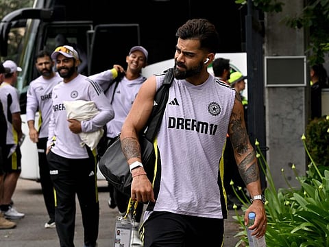 Indias Virat Kohli arrives with teammates at Manuka Oval on the second day of the two-day tour cricket match against the Prime Minister's XI in Canberra on Sunday.