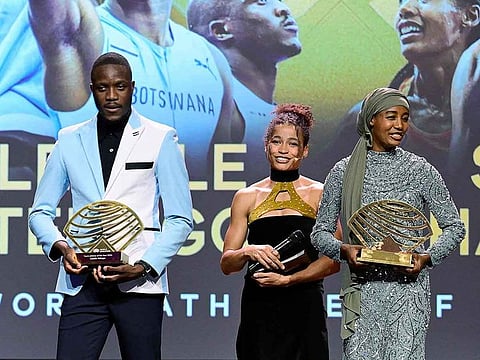 Botswanan sprinter Letsile Tebogo (L) holding his the Men’s Track Athlete of the Year Award and Dutch middle and long-distance runner Sifan Hassan (R) holding her the Women’s Out of Stadium Athlete of the Year Award.