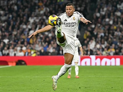 Real Madrid's French forward Kylian Mbappe controls the ball during the Spanish league football match against Getafe CF at the Santiago Bernabeu stadium in Madrid on Sunday.