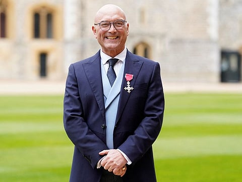 Gregg Wallace poses with his medal after being appointed an Officer of the Order of the British Empire (OBE) at Windsor Castle, southern England, on February 28, 2023. The BBC faced pressure on December 2, 2024 to take one of its most popular and long-running shows, "MasterChef", off air following claims one of the programme's presenters, Gregg Wallace, engaged in sexually harassing behaviour.
