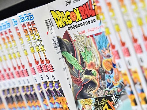 Books from the popular 'Dragon Ball' manga series on a shelf in a store in downtown Tokyo.
