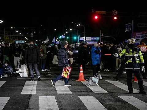 Protesters against South Korean President Yoon Suk Yeol occupy the street outside the National Assembly in Seoul, South Korea.