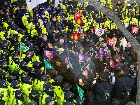 Protesters against South Korean President Yoon Suk Yeol blocked by the police before reaching the presidential office during a demonstration in Seoul, South Korea, on Wednesday, December 4, 2024.