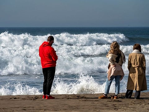 Pedestrians on Ocean Beach after a tsunami warning in San Francisco, California, on Thursday, December 5, 2024. A magnitude-7.0 earthquake off the coast of Northern California triggered a tsunami warnings across a swath of the US West Coast, but it passed less than an hour later.
