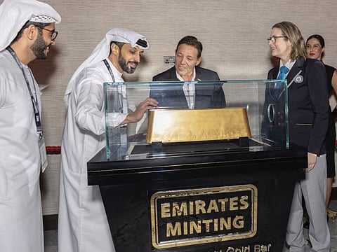Essa Al Falasi (2nd from L) during the Guiness World Record recognition for the world's largest gold bar.