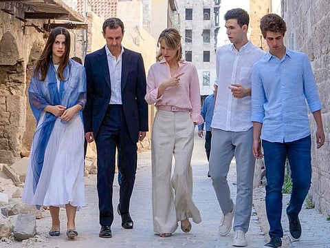 Al Assad and his wife Asma (centre) walking with their children, Hafez (second right), Karim and Zein next to the Grand Umayyad mosque in the northern Syrian city of Aleppo on July 8, 2022.
